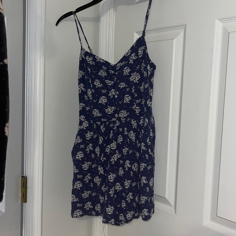Dark blue and white romper with buttons and pockets